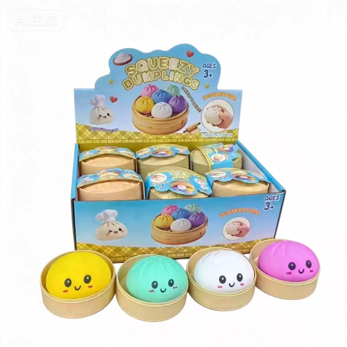 Display box of Squeezzy Dumplings toys with colorful dumplings on a white background