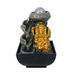 A golden Ganesha statue with a serene water feature behind it, set on a black base which appears to be the fountain's base.