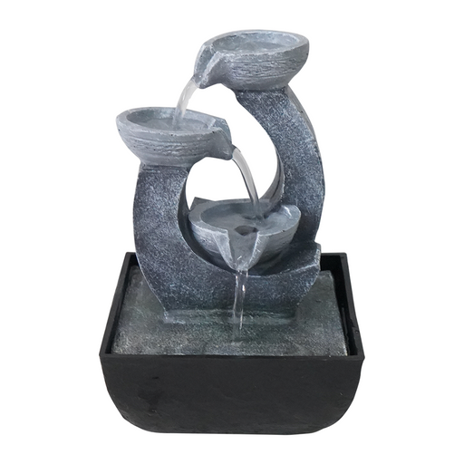 A modern Zen-inspired water feature with a minimalist design, consisting of two stylized pots made of a dark material, with water flowing from one pot to the other.