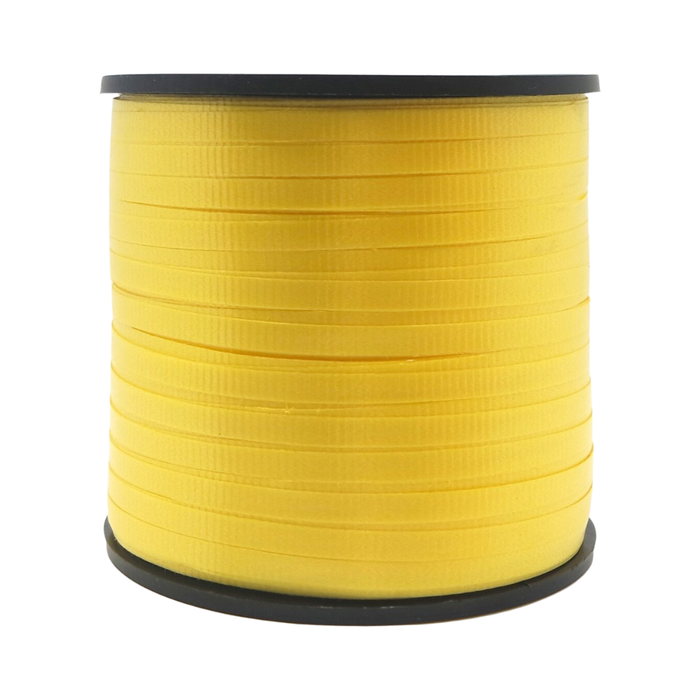 Spool of yellow ribbon on a white background