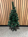 White-tipped pine Christmas tree in living room setting