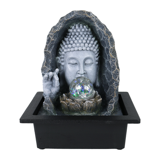 A Zen-inspired water feature with a sculpture of the Buddha meditating and gazing at a water globe, set within a black pot.