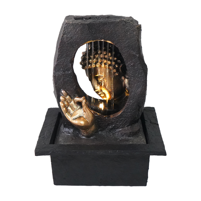 A Zen-inspired water feature fountain with a bronze-colored meditating Buddha figure on a black base, with water flowing over the Buddha's hand.