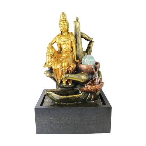A bronze-colored fountain figure of Guanyin, the Buddhist goddess of water, seated on a base that includes a series of copper-colored tiers and a large green stone.