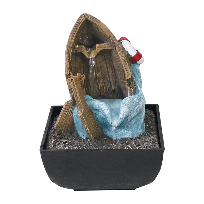 A fountain featuring a weathered wooden boat structure with a blue sail, a red life preserver, and a fishing net, set on a black base.