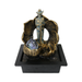 Decorative fountain with a cowboy figure and shell design on a white background