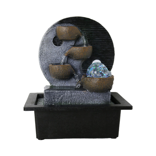 Decorative water fountain with three stone-like bowls and a glowing ball on a white background