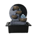 Decorative water fountain with three stone-like bowls and a glowing ball on a white background