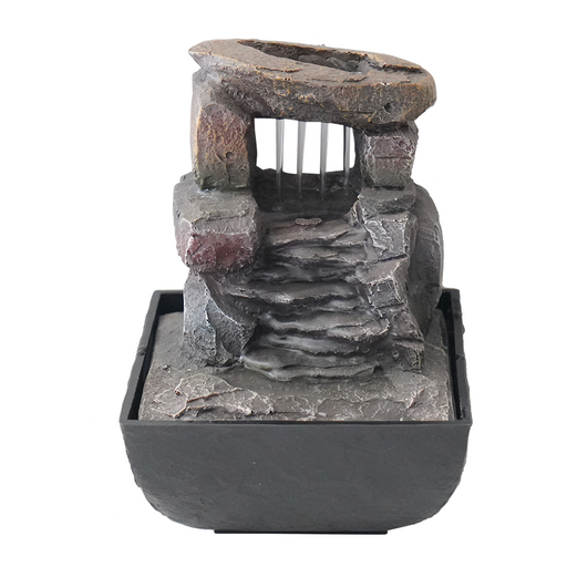A modern Zen-inspired water feature with a minimalist design, consisting of a series of cascading bowls made of stone, placed one inside the other, with water flowing from the top bowl down to the bottom.