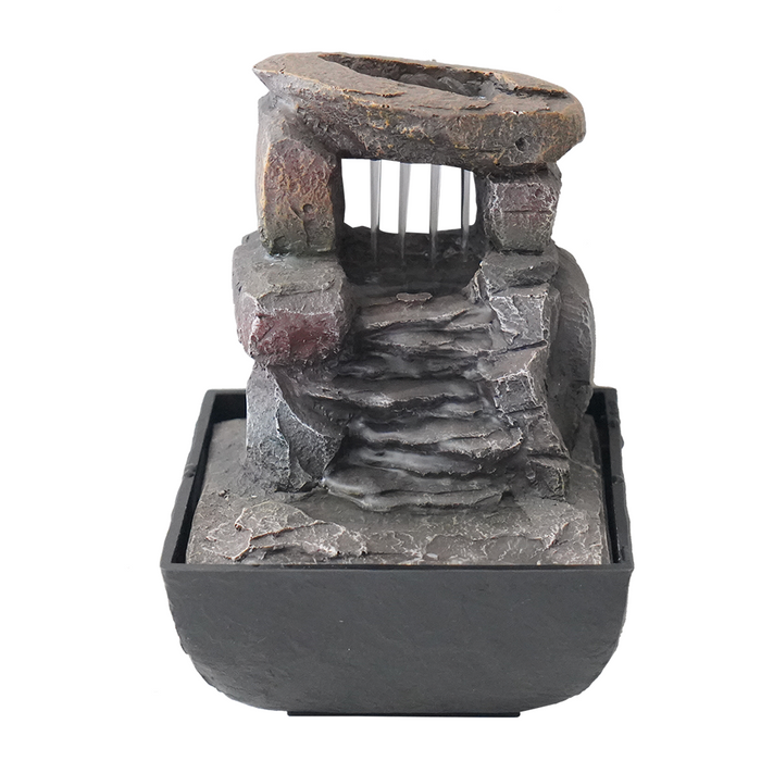 A modern Zen-inspired water feature with a minimalist design, consisting of a series of cascading bowls made of stone, placed one inside the other, with water flowing from the top bowl down to the bottom.