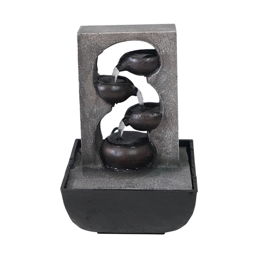 A modern Zen-inspired water feature with three cascading bowls made of stone, placed one inside the other, with water flowing through them, set in a black square base.