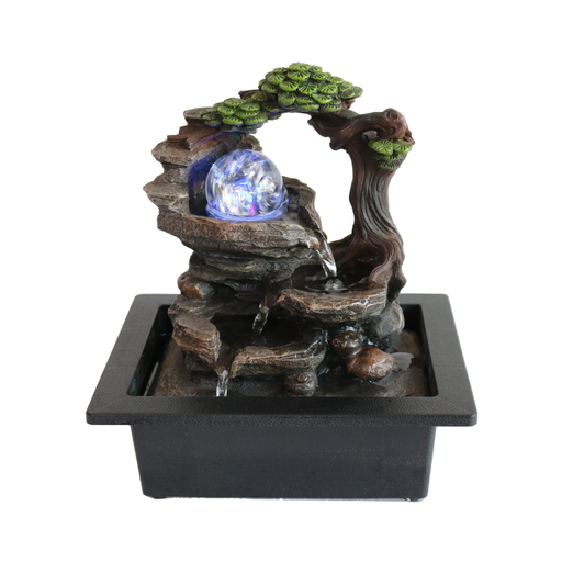 Decorative water fountain with LED light on a white background