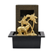 A black fountain featuring a golden elephant with a palm tree, set on a sleek base.