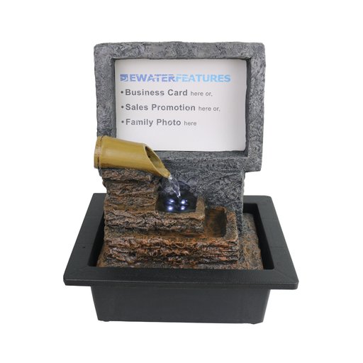 Faux stone water feature with a business card holder on a white background